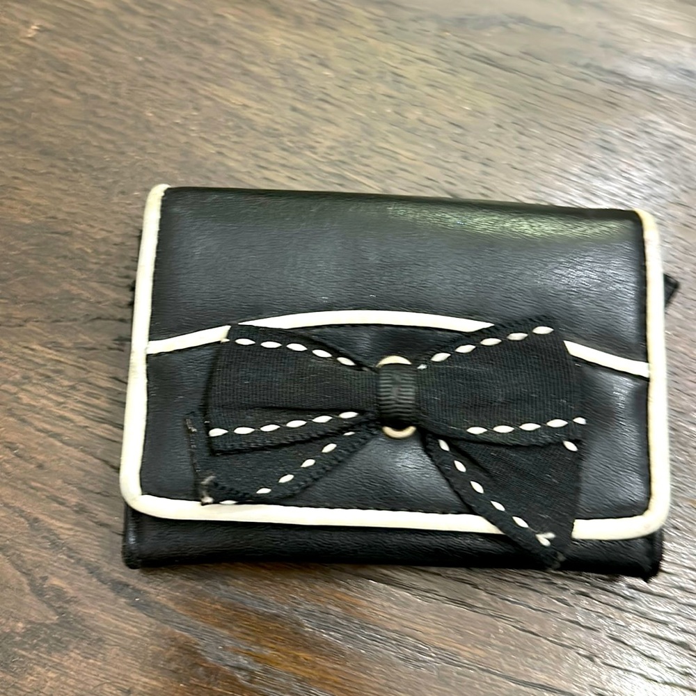 Black leather wallet, lightly used. Great stocking stuffer for a girl.